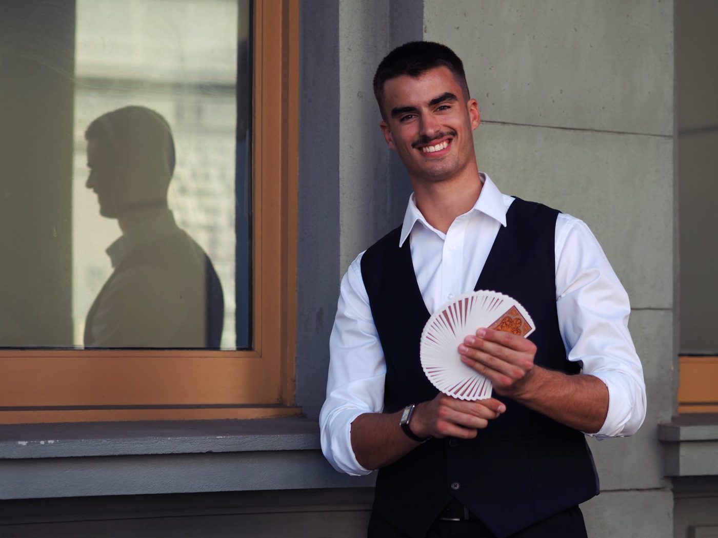 Dominic Miles fanning a deck of cards